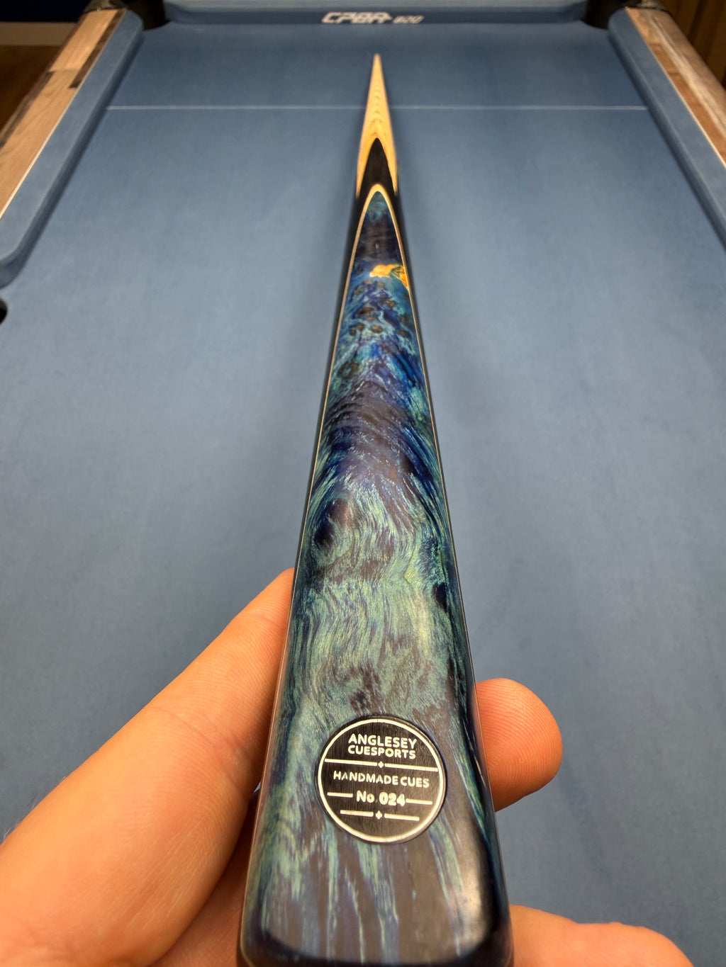 Anglesey Cuesports Blue Peacock Cue No.024 - full length tip end view on table