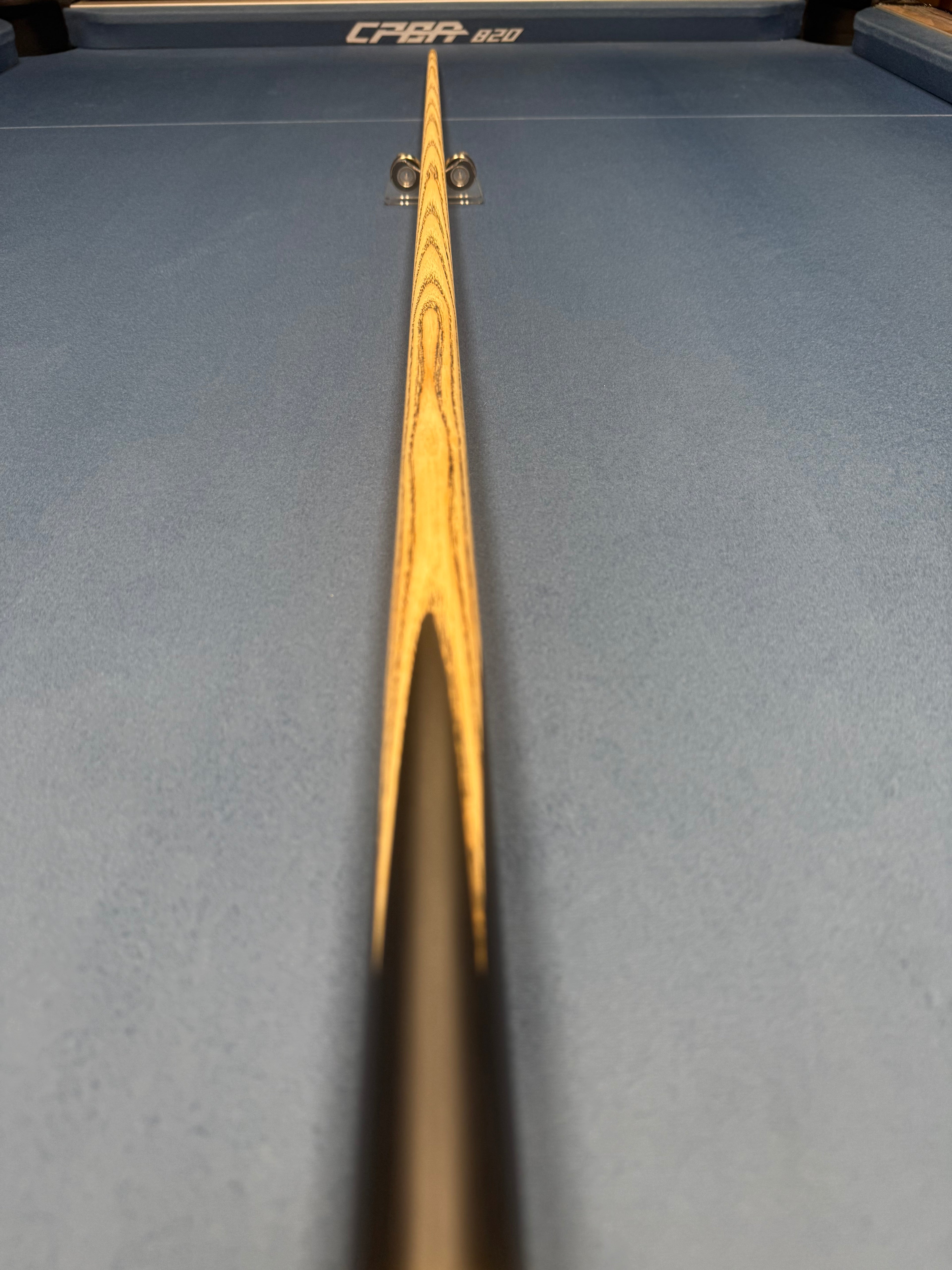 Anglesey Cuesports Zebrawood Cue No.025 - full length tip end view on table
